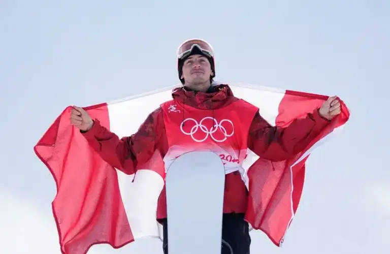 Max McMorris Holding The Canadian Flag At Olympics
