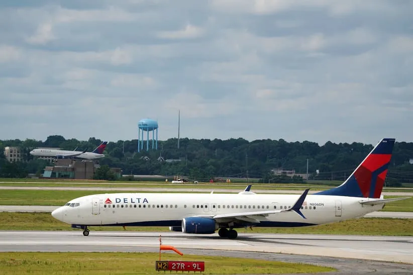Jun 30, 2022; Atlanta, GA, USA; A Delta 737-900ER Atlanta to Miami flight lines up on the runway during normal operations