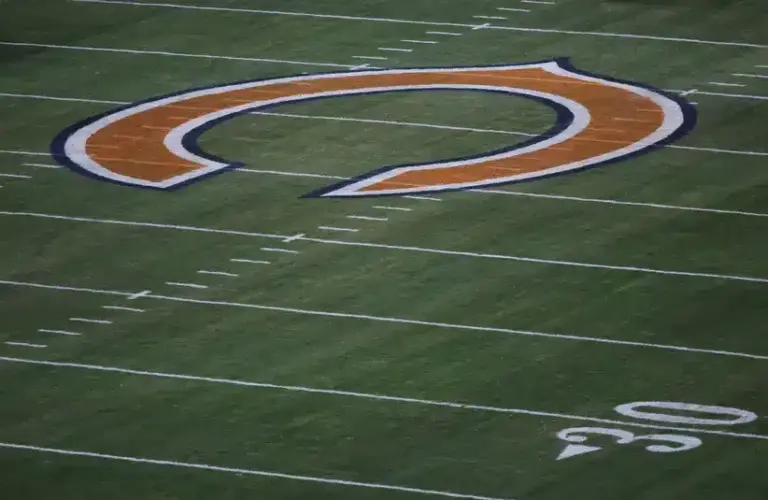 Chicago Bears logo at midfield before a game against the Seattle Seahawks at Soldier Field. JB Pritzker