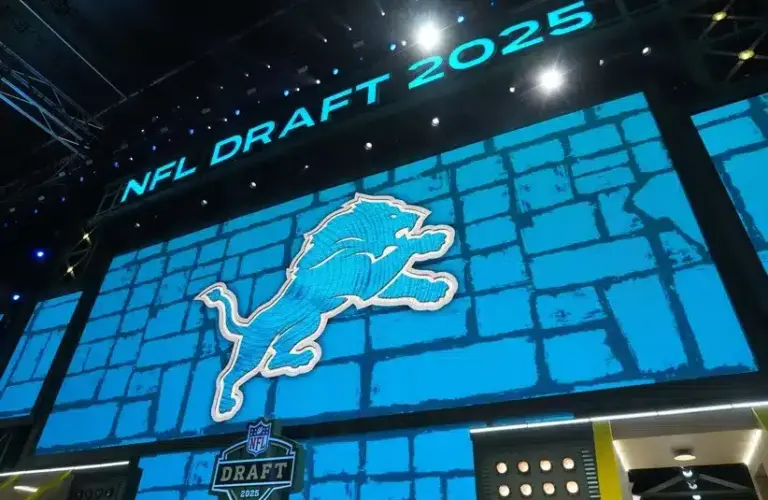 The Detroit Lions logo is projected on the video board, Jack Campbell