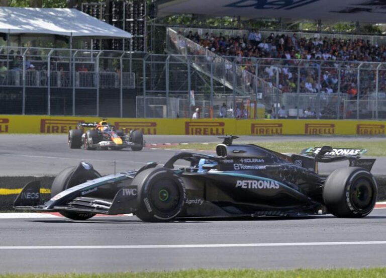 Jun 15, 2025; Montreal, Quebec, Canada; Mercedes driver George Russell (63) leads Red Bull Racing driver Max Verstappen (1) during the F1 Montreal Grand Prix at Circuit Gilles-Villeneuve.