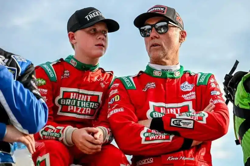 Former NASCAR Cup Series champion Kevin Harvick, center, right, and his son Keelan, 13, look on before the two raced in the 13th annual Masters of the Pros 200 race on Wednesday, July 16, 2025, at the Owosso Speedway.