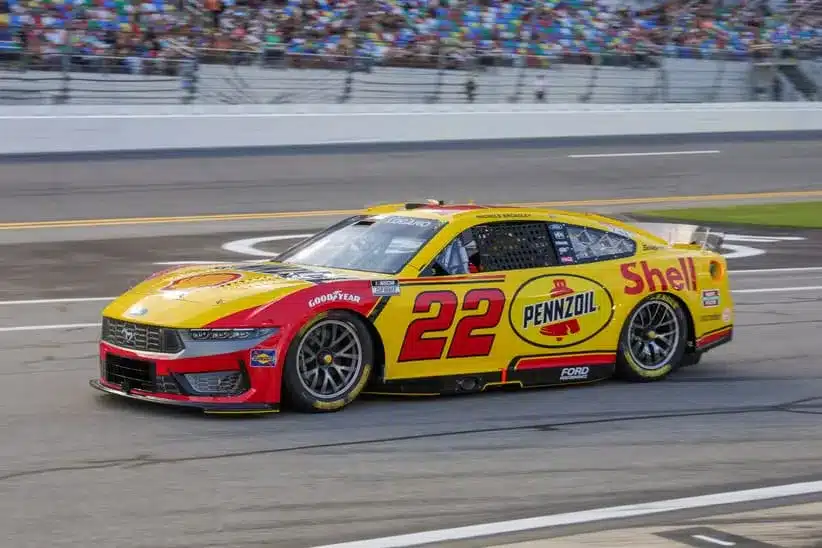 Aug 23, 2025; Daytona Beach, Florida, USA; NASCAR Cup Series driver Joey Logano (22) exits pit road before the start of the Coke Zero Sugar 400 at Daytona International Speedway.