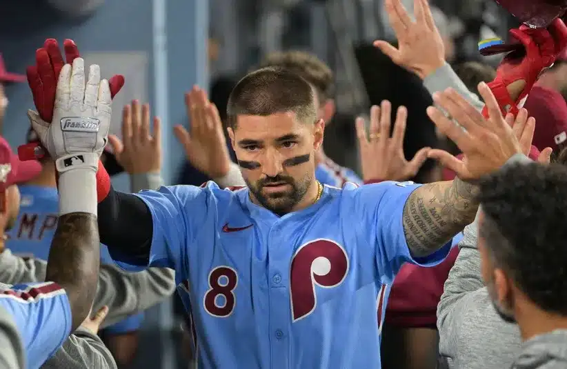 Philadelphia Phillies right fielder Nick Castellanos (8) celebrates after scoring a run during the eighth inning against the Los Angeles Dodgers