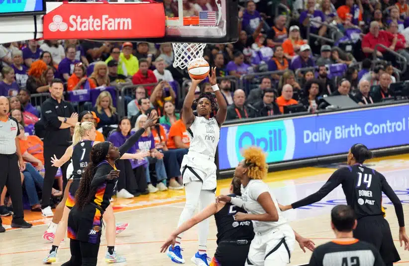 Chelsea Gray puts up a shot in a WNBA game.