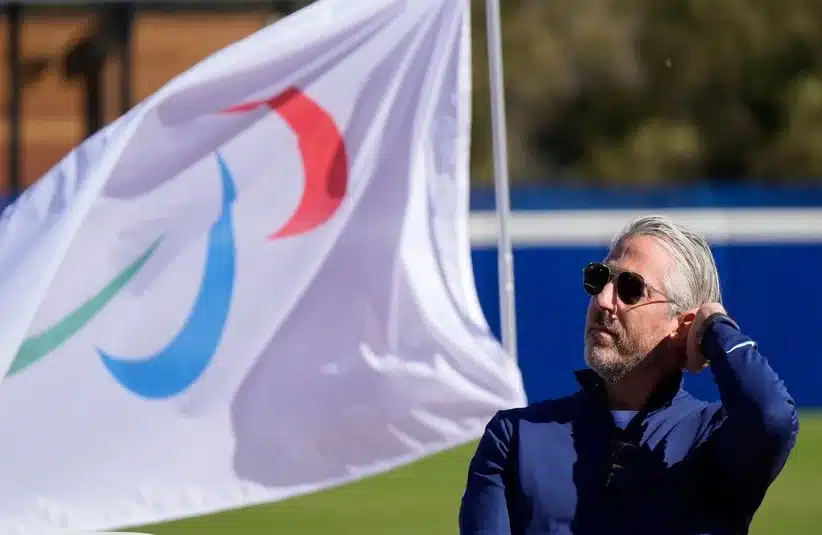 Wasserman with the Winter Olympics flag