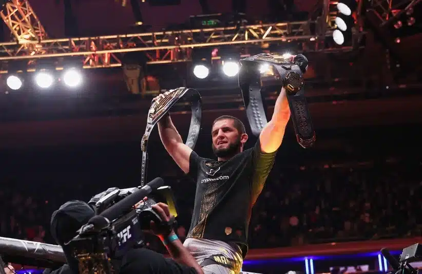 Makhachev holding his belts