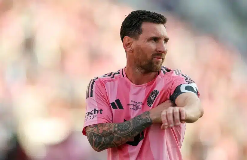 Messi fitting his armband