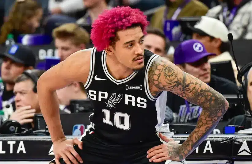 San Antonio Spurs forward Jeremy Sochan (10) stretches before substituting in during the second half against the Utah Jazz