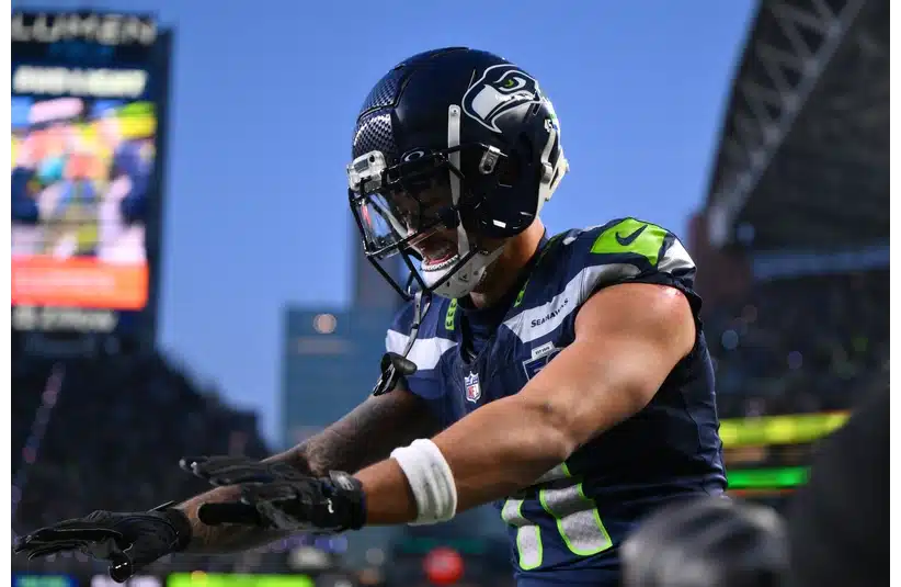 Jaxon Smith-Njigba celebrates after scoring a touchdown against the Rams
