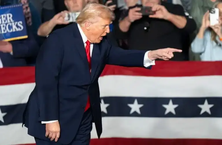 President Donald Trump points into the crowd during a rally and UFC is heading to the White House