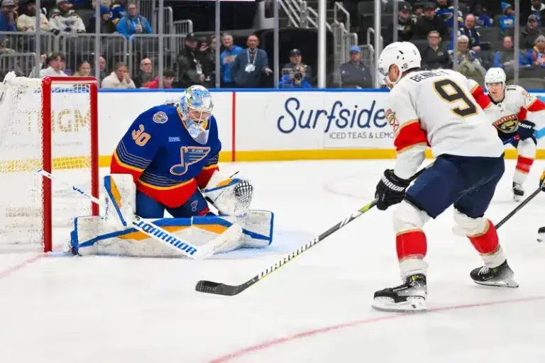 Sam Bennett Shooting A Puck At Joel Hofer