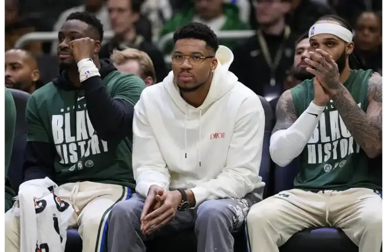 Giannis on the sideline watching the game