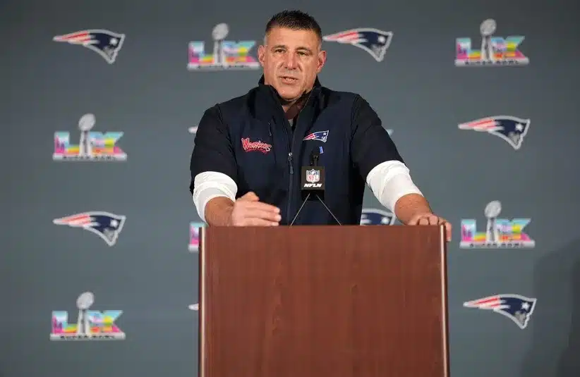New England Patriots head coach Mike Vrabel talks to media members at the Santa Clara Marriott