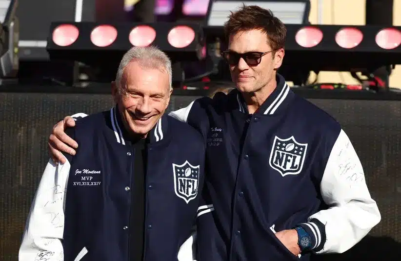 Tom Brady and Joe Montana look on before Super Bowl LX