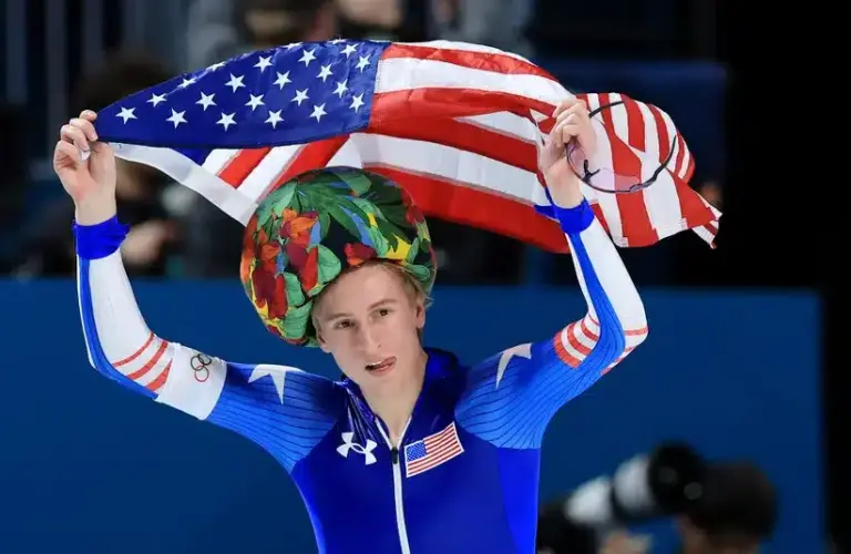 Jordan Stolz of the United States celebrates winning gold in men's speed skating 1000m during the Milano Cortina 2026 Olympic Winter Games at Milano Speed Skating Stadium.