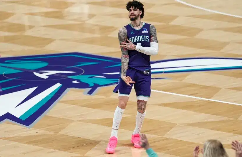 Charlotte Hornets guard LaMelo Ball reacts to his three point basket during the second half against the Atlanta Hawks at Spectrum Center.