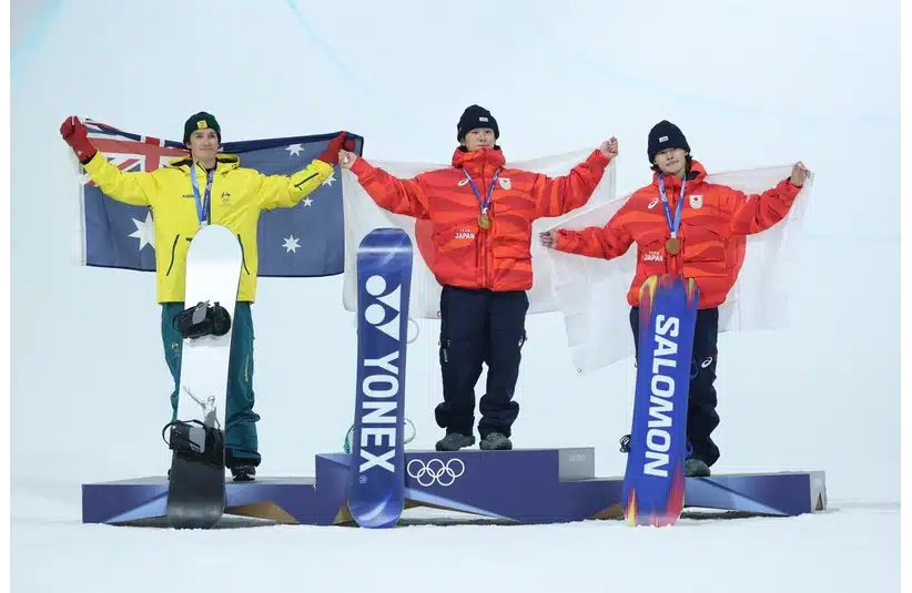 Scotty James of Australia, Yuto Totsuka of Japan and Ryusei Yamada of Japan on the podium after the men's snowboarding halfpipe final.