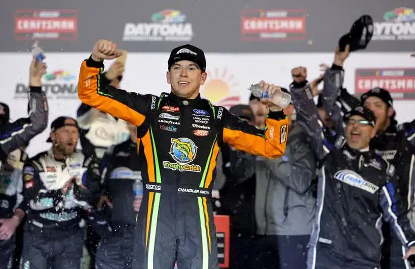 Feb 13, 2026; Daytona Beach, Florida, USA; NASCAR Truck Series driver Chandler Smith (38) celebrates after winning the Craftsman Truck series Fresh From Florida 250 at Daytona International Speedway.
