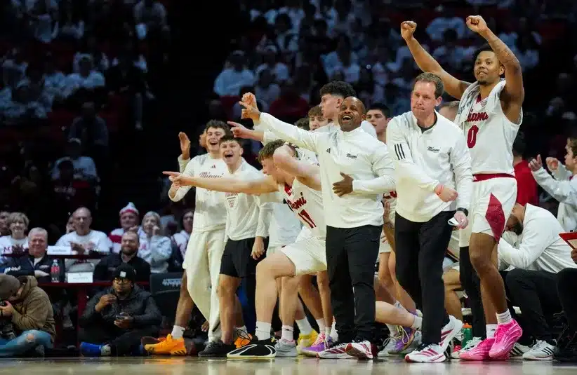 The Miami (OH) RedHawks bench reacts.