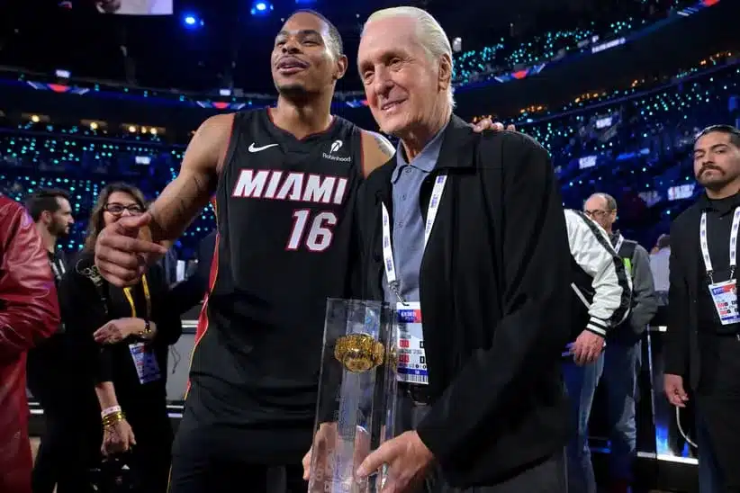 Feb 14, 2026; Los Angeles, CA, USA; Miami Heat forward Keshad Johnson (16) celebrates with the trophy and Pat Riley after winning the slam dunk competition during the 2026 NBA All Star Saturday Night at Intuit Dome.