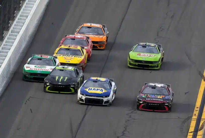 Feb 15, 2026; Daytona Beach, Florida, USA; NASCAR Cup Series driver Tyler Reddick (45) races alongside Chase Elliott (9), Riley Herbst (35) and Brad Keselowski (6) coming to the checkered flag of the 68th running of the Daytona 500 at Daytona International Speedway.
