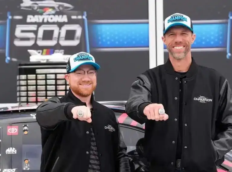 Daytona 500 winner Tyler Reddick, left, poses with crew chief Billy Scott during their champion ceremony in Victory Lane, Monday, Feb. 16, 2026.