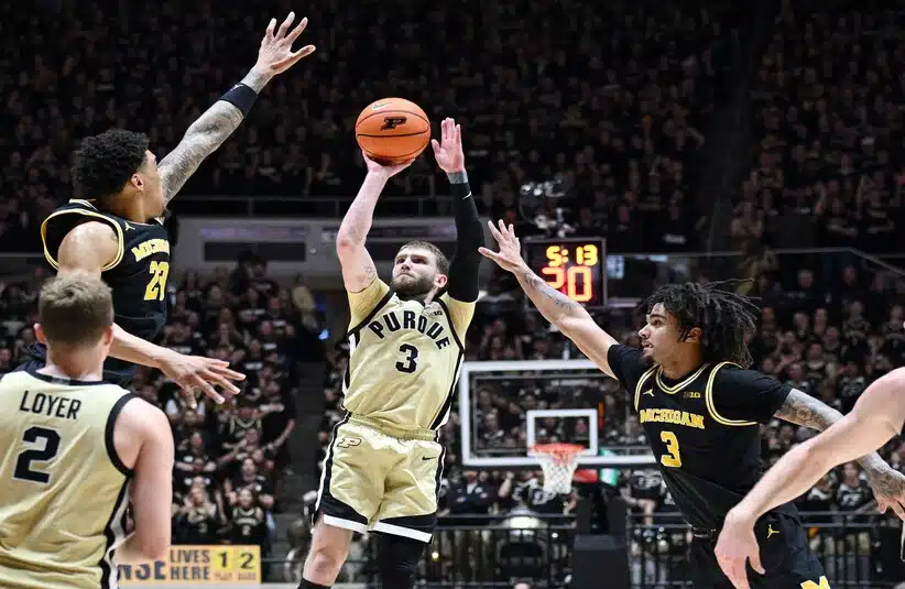 Purdue point guard Braden Smith puts a shot up against Michigan.