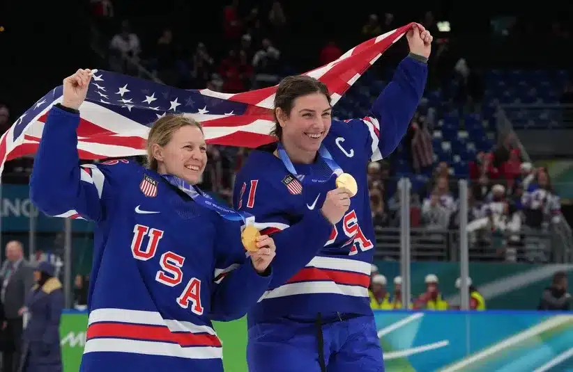 Kendall Coyne (26) of the United States and Hilary Knight (21) of the United States celebrate after winning the gold medal in women's ice hockey