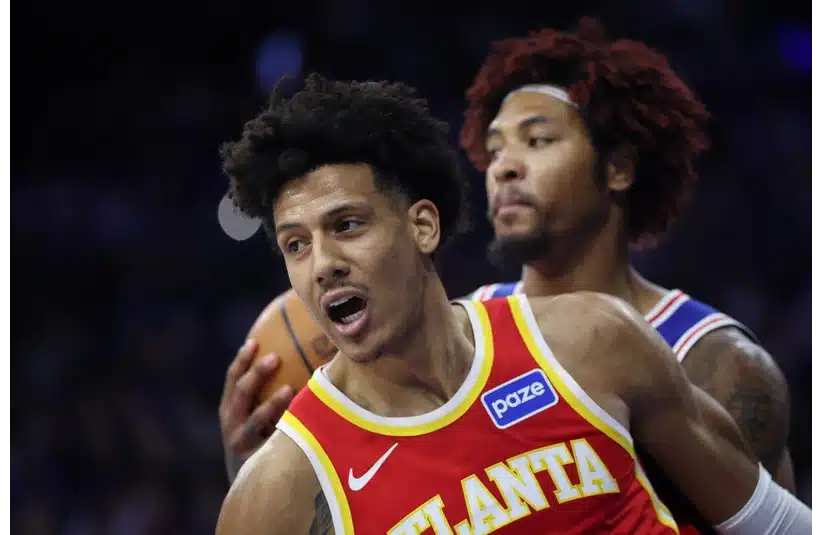 Hawks forward Jalen Johnson reacts to his score