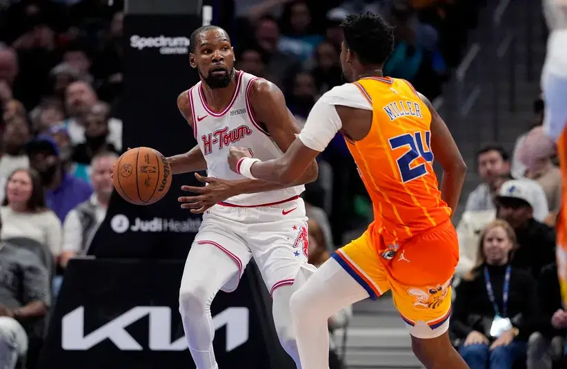 Houston Rockets forward Kevin Durant (7) brings the ball up court defended by Charlotte Hornets forward Brandon Miller (24) during the second half.