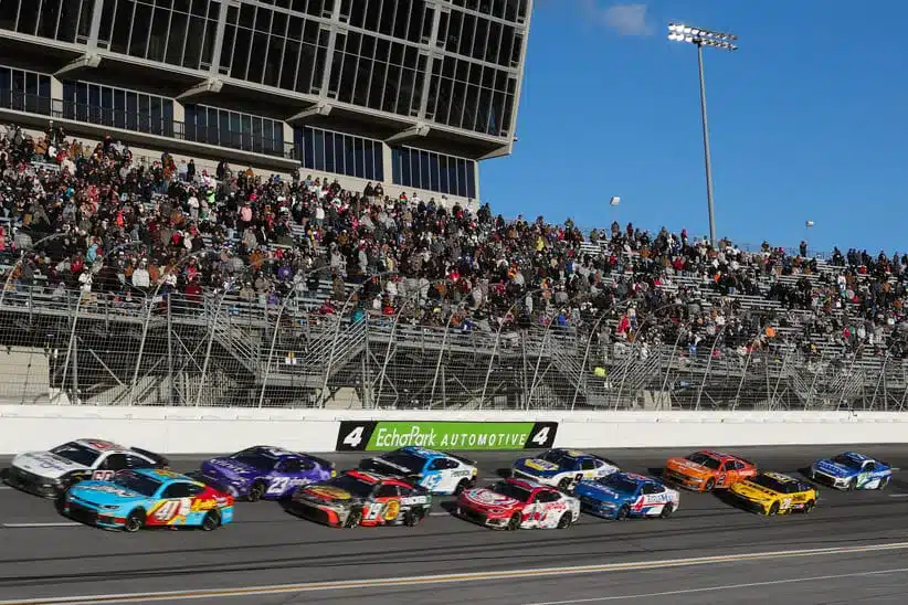 Feb 22, 2026; Hampton, Georgia, USA; NASCAR Cup Series drivers round the track at EchoPark Speedway.