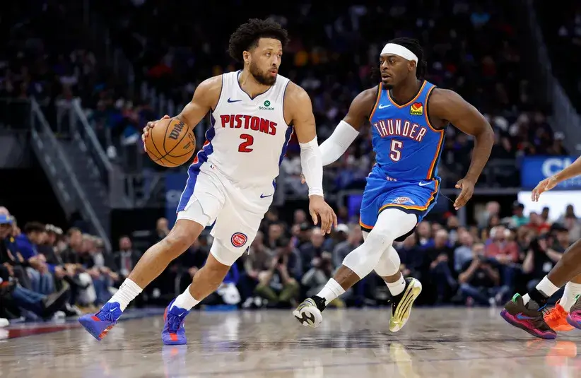 Detroit Pistons guard Cade Cunningham (2) dribbles on Oklahoma City Thunder guard Luguentz Dort (5) in the first half.