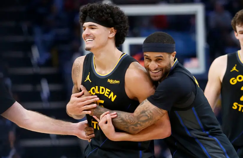 Golden State Warriors guard Gary Payton II (0) embraces forward Gui Santos (15) during the second half against the Memphis Grizzlies.