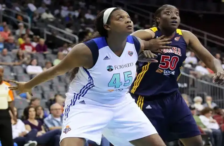 New York Liberty forward Kara Braxton (45) and Indiana Fever center Jessica Davenport (50) battle for position