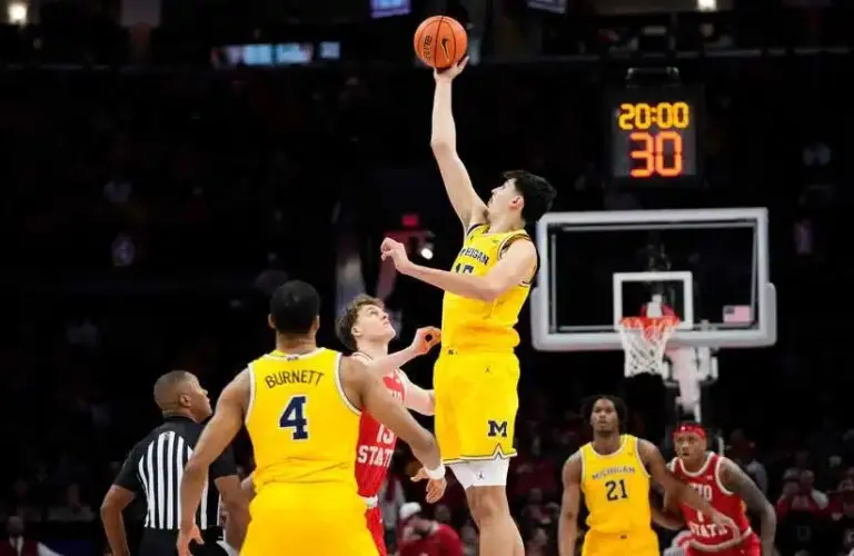 Michigan Wolverines center Aday Mara (15) takes the opening tipoff against Ohio State Buckeyes center Christoph Tilly (13) during the NCAA men's basketball game at the Schottenstein Center in Columbus on Feb. 8, 2026.
