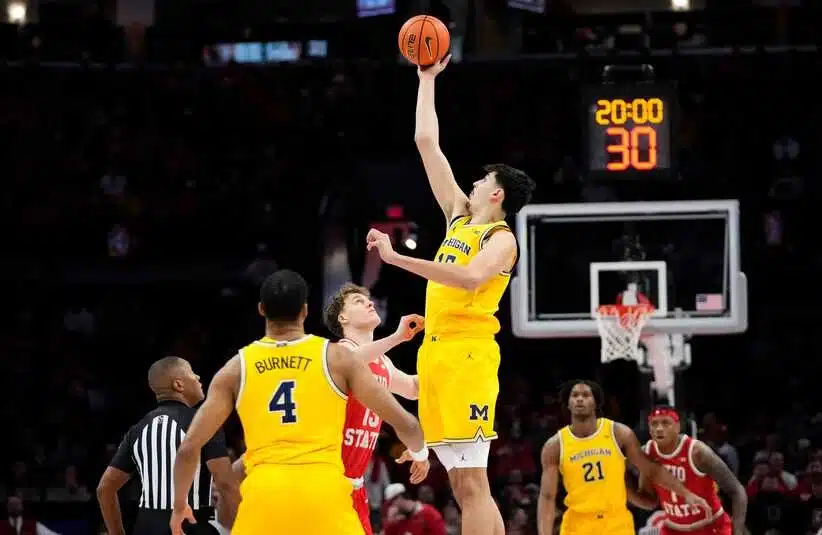 Michigan Wolverines center Aday Mara (15) takes the opening tipoff against Ohio State Buckeyes center Christoph Tilly (13) during the NCAA men's basketball game at the Schottenstein Center in Columbus on Feb. 8, 2026.