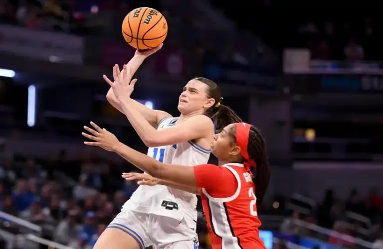 Mar 7, 2026; Indianapolis, IN, USA; UCLA Bruins forward Gabriela Jaquez (11) shoots past Ohio State Buckeyes guard Chance Gray (2) during the first half at Gainbridge Fieldhouse.