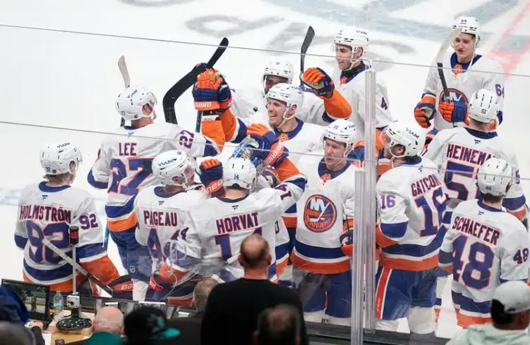 Mar 7, 2026; San Jose, California, USA; New York Islanders center Bo Horvat (14) celebrates with teammates after scoring the game-winning goal against the San Jose Sharks during the overtime period at SAP Center at San Jose.