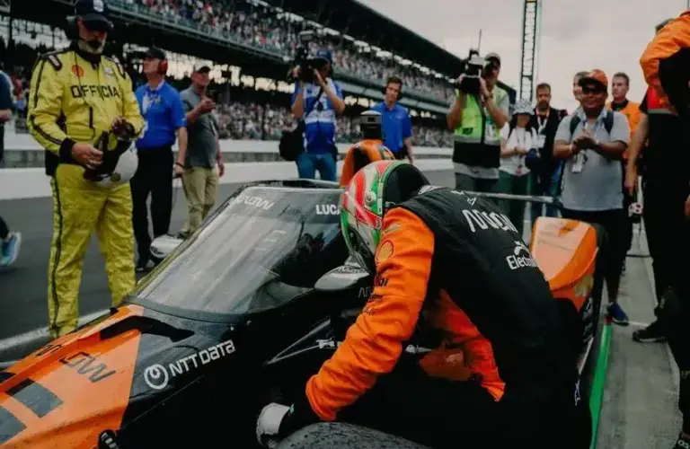 Pato O'Ward In Front Of Car At A Race
