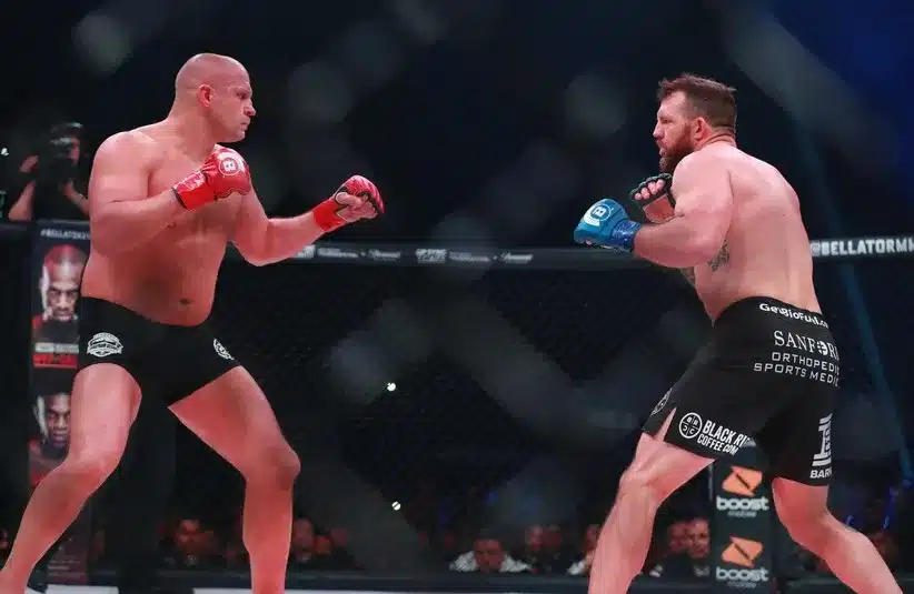 Ryan Bader (blue gloves) and Fedor Emelianenko (red gloves) during Bellator 214 at The Forum.