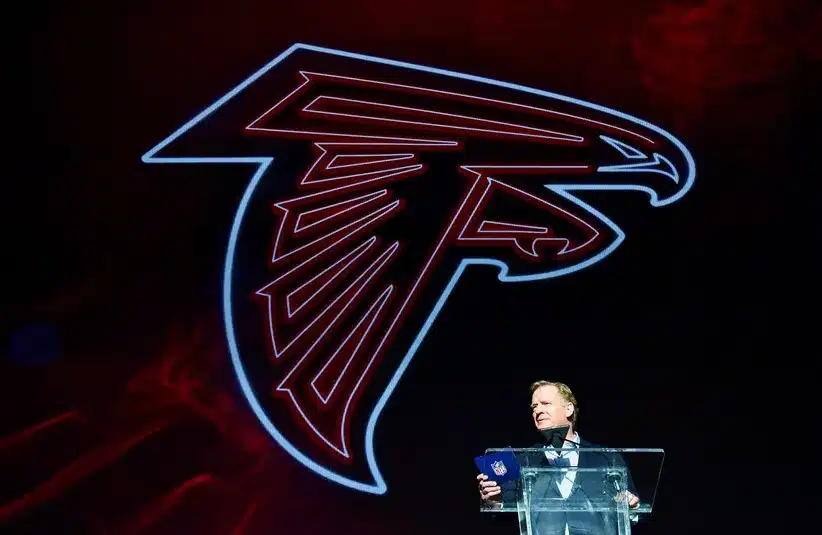 Atlanta Falcons Logo Behind Roger Goodell Announcing A Draft Pick In 2022 NFL Draft