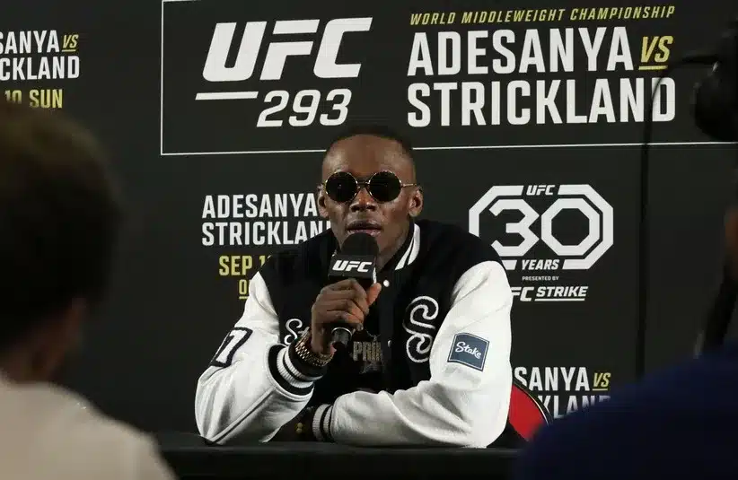 Israel Adesanya talks to the media