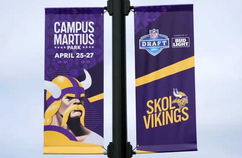 A Minnesota Vikings banner on E. Montcalm St. promoting the 2024 NFL Draft.