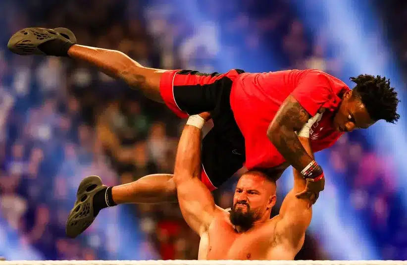 Bron Breakker hoists Speed on Saturday, Feb. 1, 2025, during the WWE Royal Rumble at Lucas Oil Stadium in Indianapolis.