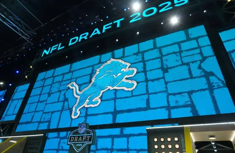 The Detroit Lions logo is projected on draft stage screen during the 2025 NFL Draft