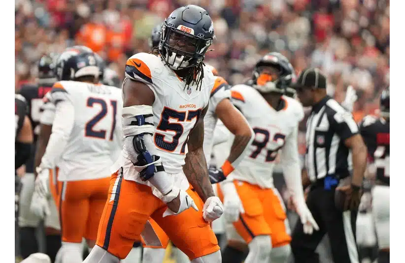 Broncos LB Dre Greenlaw reacts after a play against the Texans