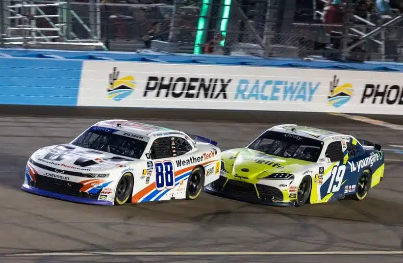 Nov 1, 2025; Avondale, Arizona, USA; NASCAR Xfinity Series driver Connor Zilisch (88) leads Aric Almirola (19) during the Xfinity Series Championship race at Phoenix Raceway.