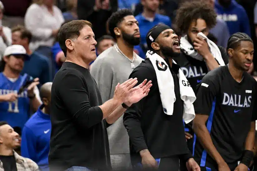 Nov 19, 2025; Dallas, Texas, USA; (from left) Dallas Mavericks minority owner Mark Cuban and forward Anthony Davis (center) and guard Jaden Hardy (right) watch the game against the New York Knicks during the second half at the American Airlines Center.