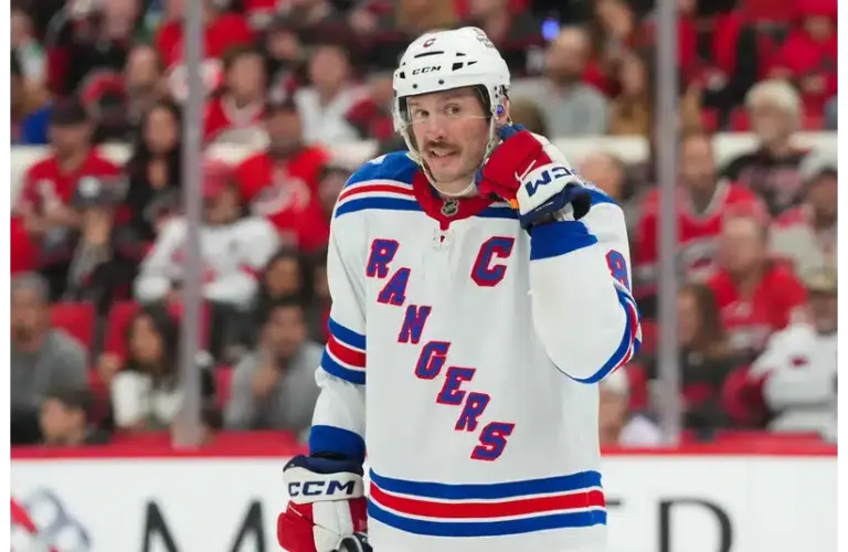 J.T. Miller reacts against the Hurricanes